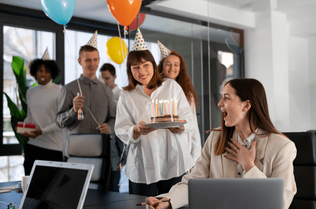 Office employees celebrating a colleague's birthday