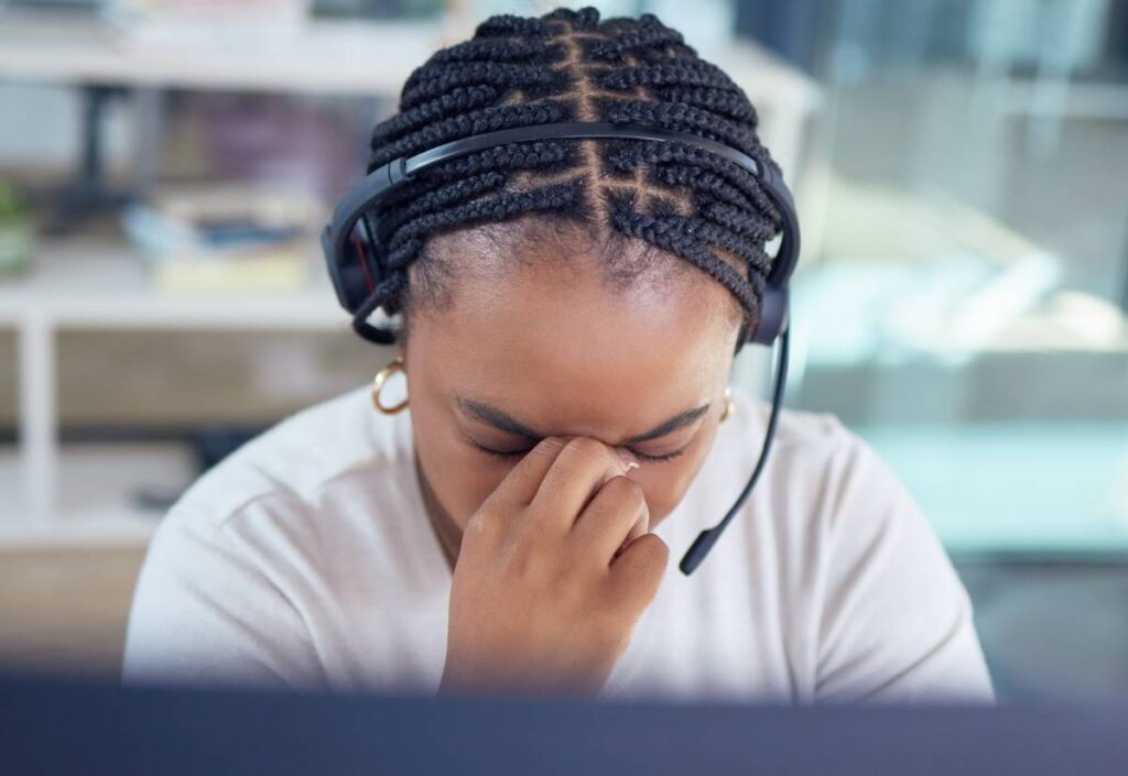 Call center employee stressed out due to lack of digital agents in the workplace