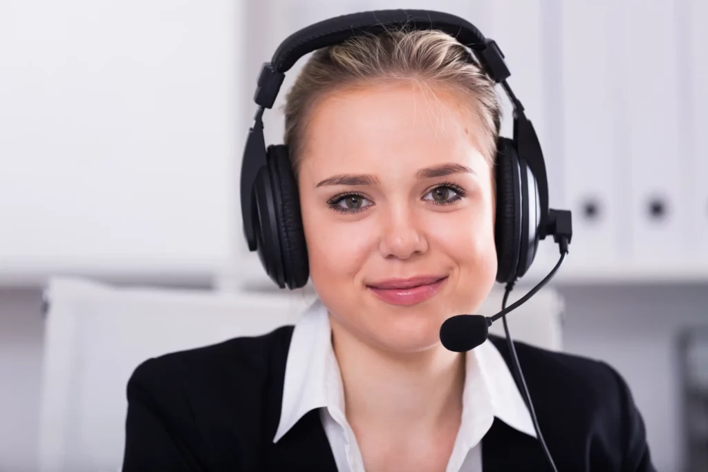 A proactive female customer service agent on the line with a customer